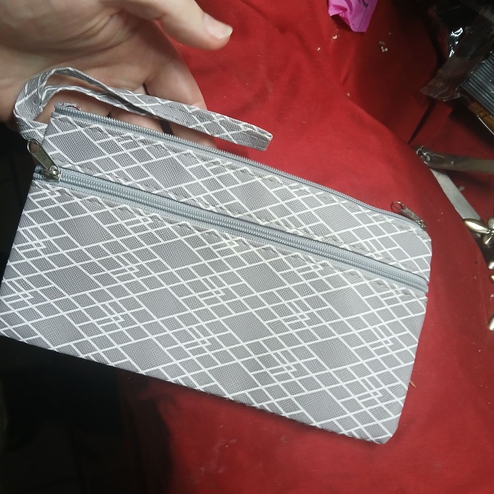 Juncture gray geometric patterned pouch wristlet.